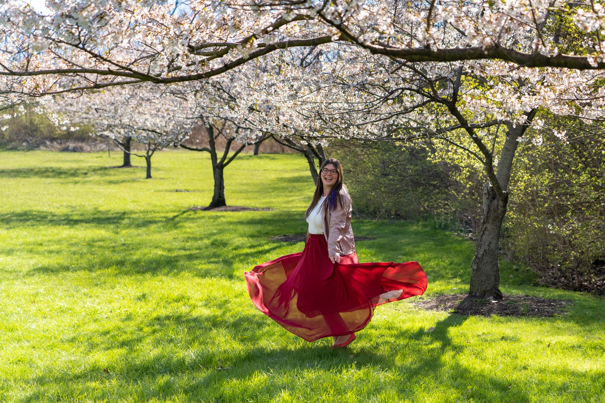 Feature image Amanda twirling under cherry blossoms