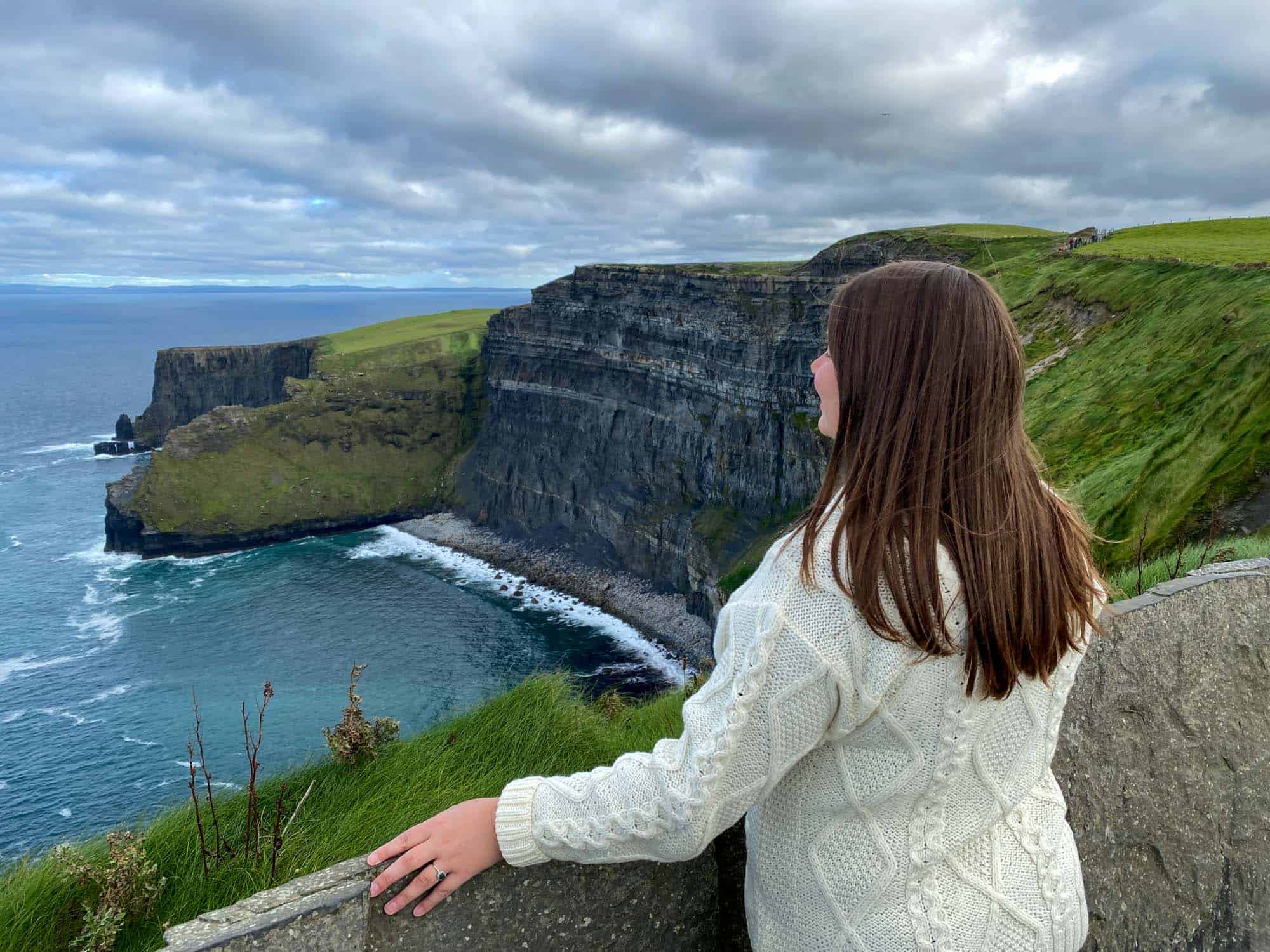 Feature image Amanda looking out over the Cliffs of Moher