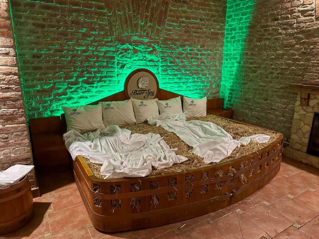 Straw bed with two sheets on top